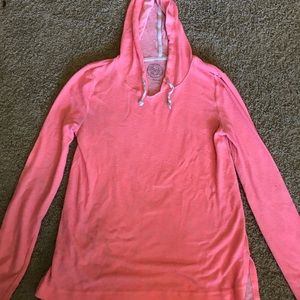 Bright pink, loose hoodie.